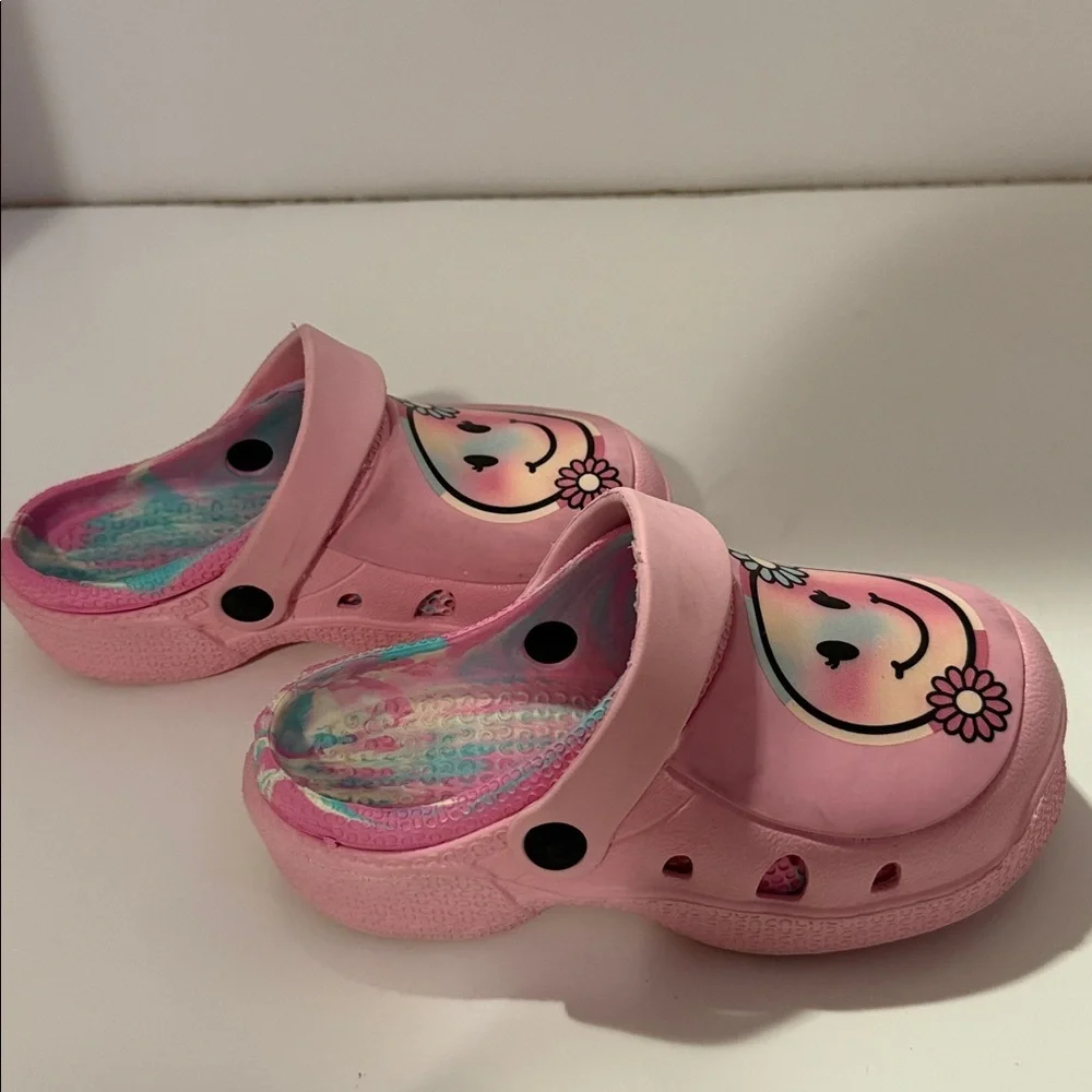 Pink clog slides‎ in a girls size 12, with pastel swirl in sole and nonslip.